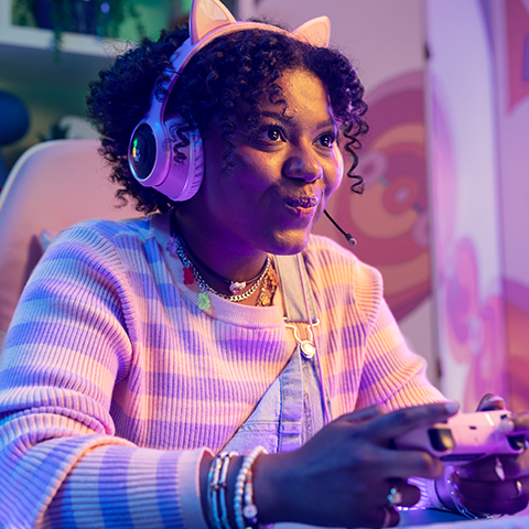 gamer wearing headphones playing a videogame_480x480
