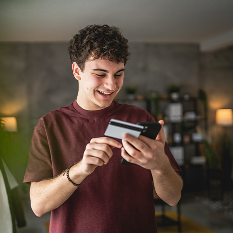 /getmedia/cf9f6e3d 7121 446e ac69 3d876d0a6712/young man entering his credit card info on his phone_480x480