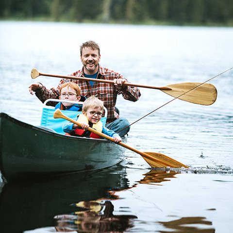 /getmedia/f6e960a9 3ff7 4db7 bfd3 7afba62eda75/Father canoeing on a lake with his two young sons